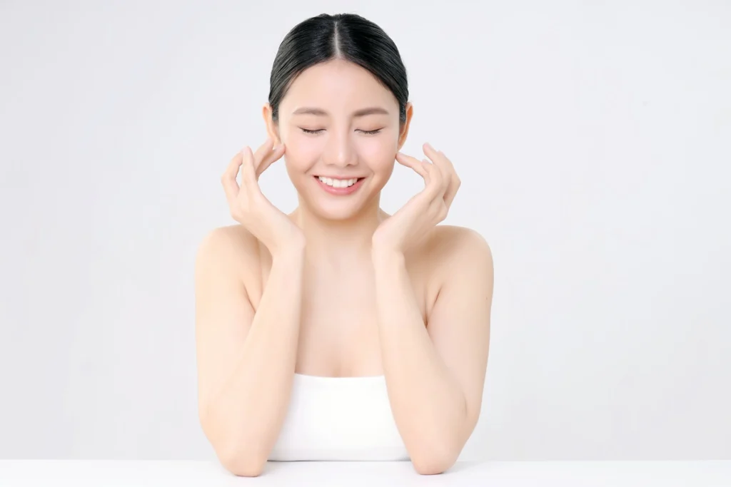 beautiful face young adult asian woman with clean fresh skin isolated white Copy
