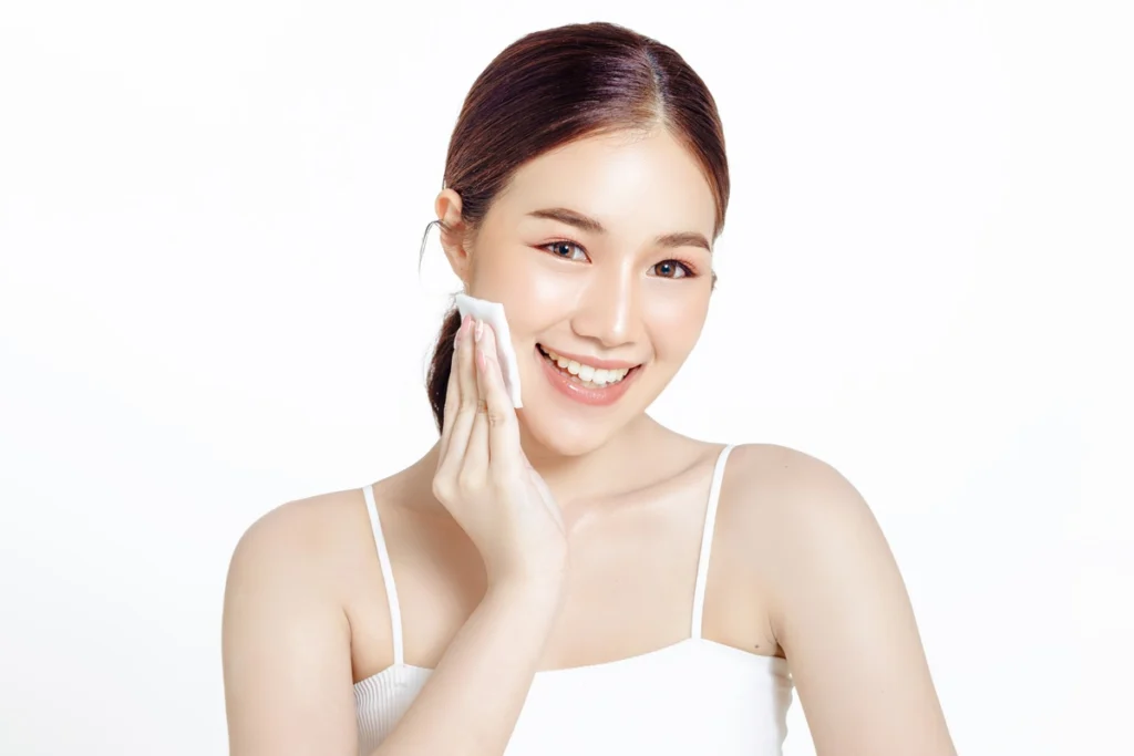 woman with beautiful face fresh skin cleaning makeup white isolated