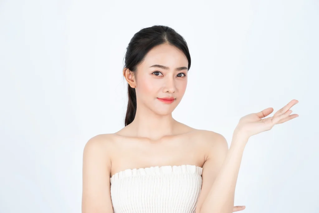 young asian beautiful girl white undershirt has healthy bright skin presenting product